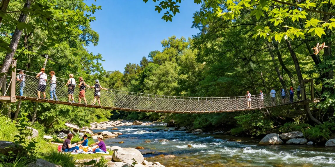 A scenic River Rope Bridge connecting lush green forests, with hikers crossing and a family picnicking nearby.