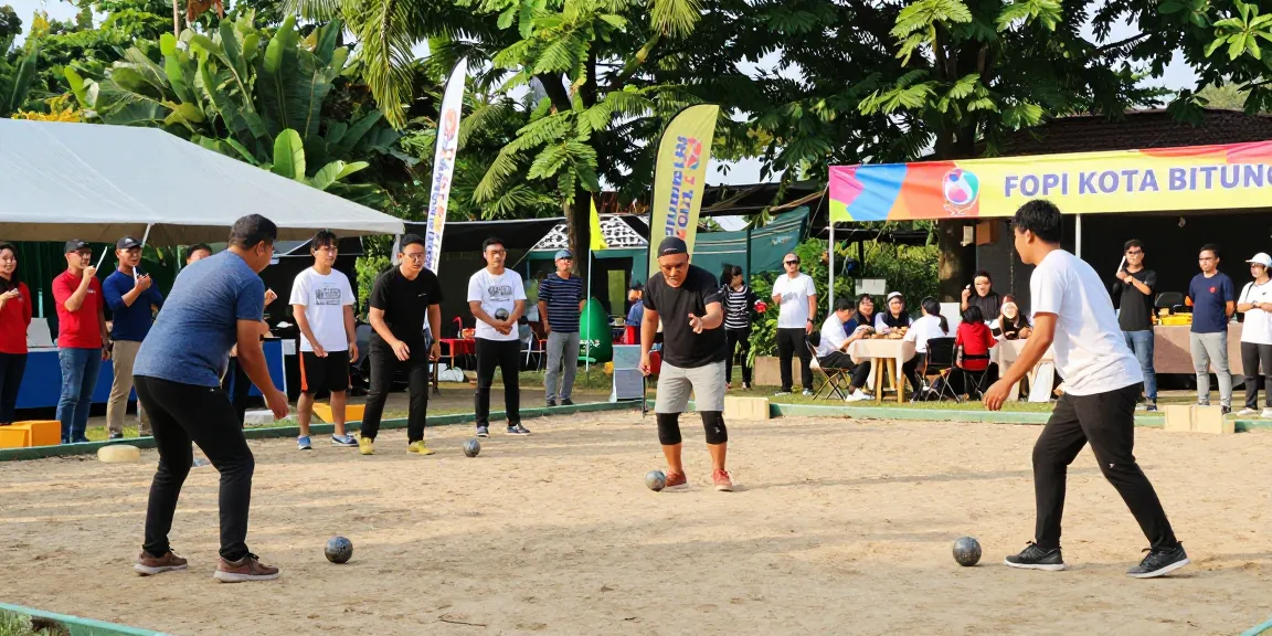 Pertandingan petanque di fopikotabitung.org, suasana ramai dengan pemain dan penonton, menyemarakkan komunitas olahraga.